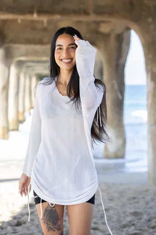 Liz walking under the pier
