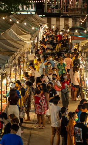 A night market corridor strung with lights