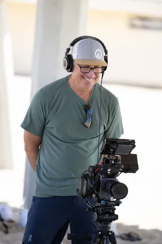 Paul on camera, headphones on