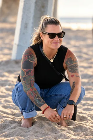 Shawni on the sand between takes